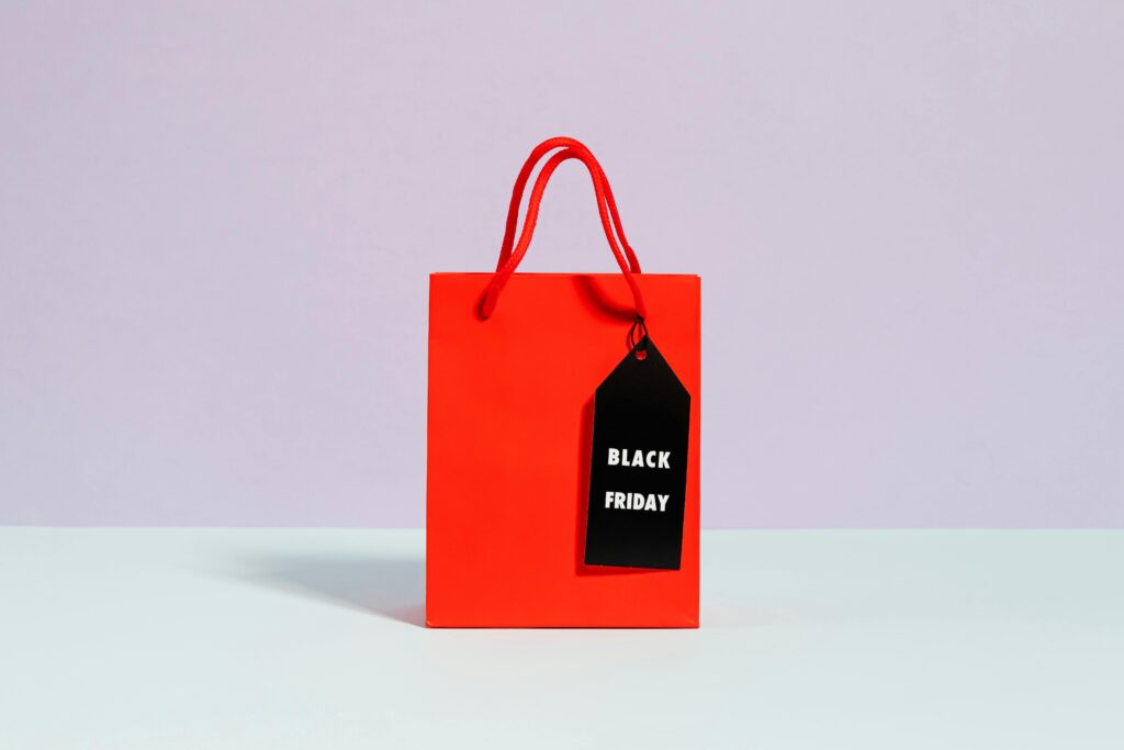 pexels photo 5632321 5632321 Vibrant red shopping bag with a Black Friday tag, perfect for sale promotions.